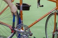 Bicycle repair, mechanic in workshop. Vintage race road bike Royalty Free Stock Photo