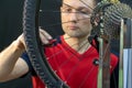 Bicycle repair. Rear wheel and tire closeup. Mechanic repairing spokes of the rear wheel of a mountain bike. Bike mechanic in the Royalty Free Stock Photo