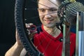 Bicycle repair. Rear wheel and tire closeup. Mechanic repairing spokes of the rear wheel of a mountain bike. Bike mechanic in the