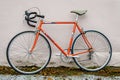 Bicycle repair. Wheel and shiny axle of chrome steel of an old road bike closeup. Retro bike. Red iron fork. Quick Release