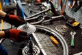 Bicycle repair in workshop, man installs cassette Royalty Free Stock Photo