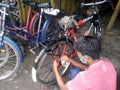 Bicycle repairing shop with local mechanic and repairman display at Barasat, N.24 Parganas. Royalty Free Stock Photo