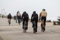 Bicycle riders on the dunes in Netherlands on a stormy day Royalty Free Stock Photo