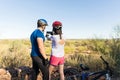 Bicycle Riders Exploring And Capturing Nature