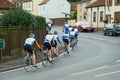 Bicycle riders training on town road Royalty Free Stock Photo