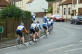Bicycle riders training on town road Royalty Free Stock Photo