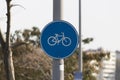 Bicycle road sign hangs on street lamp post. Close up Royalty Free Stock Photo