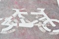 Bicycle road sign painted on asphalt Royalty Free Stock Photo