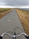 A bicycle road to nowhere twisting behind the horizon