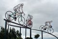 Bicycle sculpture in silhouette on the side of the road