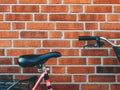 Bicycle seat leaning on to brick wall in Halmstad Royalty Free Stock Photo