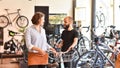 Bicycle shop consulting - salesman and customer in conversation