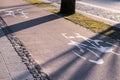 Bicycle sign in modern city, bike sign on a street. Painted Street Asphalt Bicycle Lane Sign White Safety. Royalty Free Stock Photo