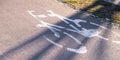 Bicycle sign in modern city, bike sign on a street. Painted Street Asphalt Bicycle Lane Sign White Safety. Royalty Free Stock Photo