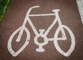 Bicycle sign painted on the road asphalt Royalty Free Stock Photo