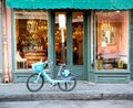 A bicycle sits outside a quaint antique store in the French Quarter of New Orleans
