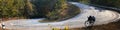 Bicycle on Slope Down Hill Country Asphalt Road no Autocar, Panorama Landscape Royalty Free Stock Photo