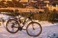 Bicycle on the snow on the boulevard