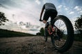 Young man riding bicycle along a country road Royalty Free Stock Photo