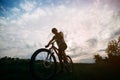 Man in helmet riding a bicycle at country road Royalty Free Stock Photo