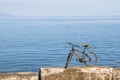 Bicycle standing on stones against backdrop of Lake Baikal