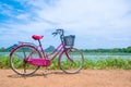 The bicycle stands on a village road at Thalkote lake near Sigiriya