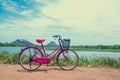 The bicycle stands on a village road at Thalkote lake near Sigiriya