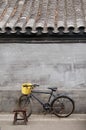 Bicycle and stool in a hutong Royalty Free Stock Photo