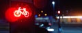 Bicycle stop red warning lamp sign on traffic light road highway driveway drive crossroad intersection evening dark time Royalty Free Stock Photo