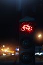 Bicycle stop red warning lamp sign on traffic light road highway driveway drive crossroad intersection evening dark time Royalty Free Stock Photo