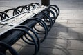 Bicycle storage in the park. Warm sunny day. Pavement and asphalt Royalty Free Stock Photo