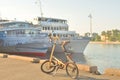 Bicycle Strida on the background of river cruise ships