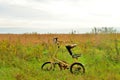 Bicycle Strida in field.