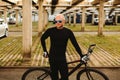 Bicycle style man in black sportswear Royalty Free Stock Photo