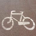 Bicycle symbol painted on red path Royalty Free Stock Photo