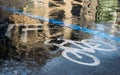 A bicycle symbol on the streets in the raining time. Royalty Free Stock Photo