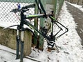 Bicycle theft. Strapped bike with stolen wheels, street crime Royalty Free Stock Photo