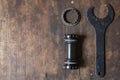 Bicycle tools for Bottom Bracket on wooden table with copy space Royalty Free Stock Photo