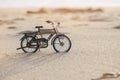 Bicycle toy on beach holiday sunset time Royalty Free Stock Photo