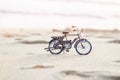 Bicycle toy on beach holiday sunset time Royalty Free Stock Photo