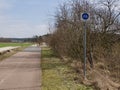 Bicycle track sign at the side of a rural road