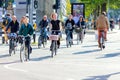 Bicycle traffic on a city street in Amsterdam. People ride bicycles. Beautiful morning light. Urban life of a modern European city