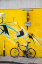 Bicycle up against a signpost in London