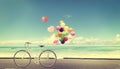 Bicycle vintage with heart balloon on beach blue sky Royalty Free Stock Photo