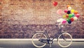 Bicycle vintage with heart balloon on road urban city