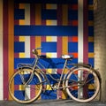 Bicycle on a wall full of geometric pattern