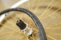 Bicycle wheel and airless tire disassembled on the floor of a bike repair shop Royalty Free Stock Photo