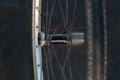 Bicycle wheel close-up on a black background. New silver rim and tire of a mountain bike. Studio background, selective focus Royalty Free Stock Photo