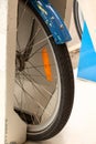 Bicycle wheel close-up in public parking bikes Royalty Free Stock Photo