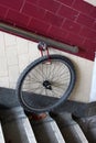 Bicycle wheel locked to a wall handrail. Forgotten bike stolen Royalty Free Stock Photo